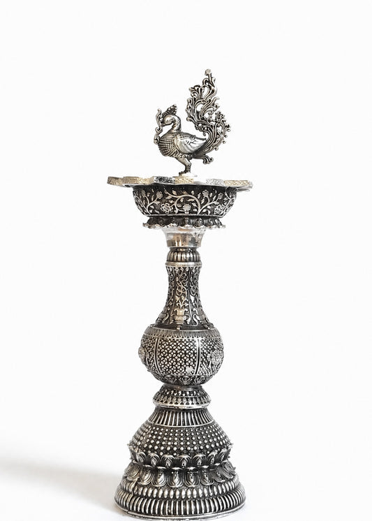 Handcrafted Silver Finish Brass Deepak Stand with Peacock Motif